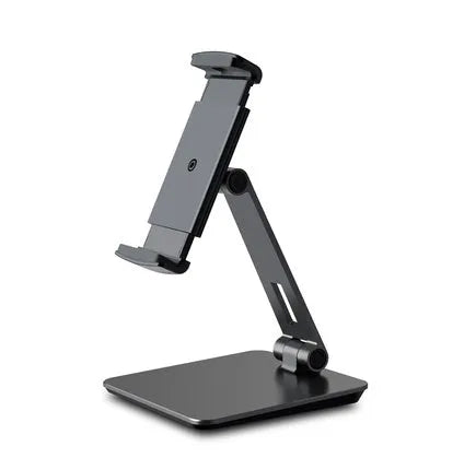 Silver foldable aluminium stand holding a tablet at an angle on a desk