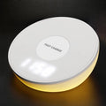 White wireless charger with digital clock display and three control buttons for mobile phones