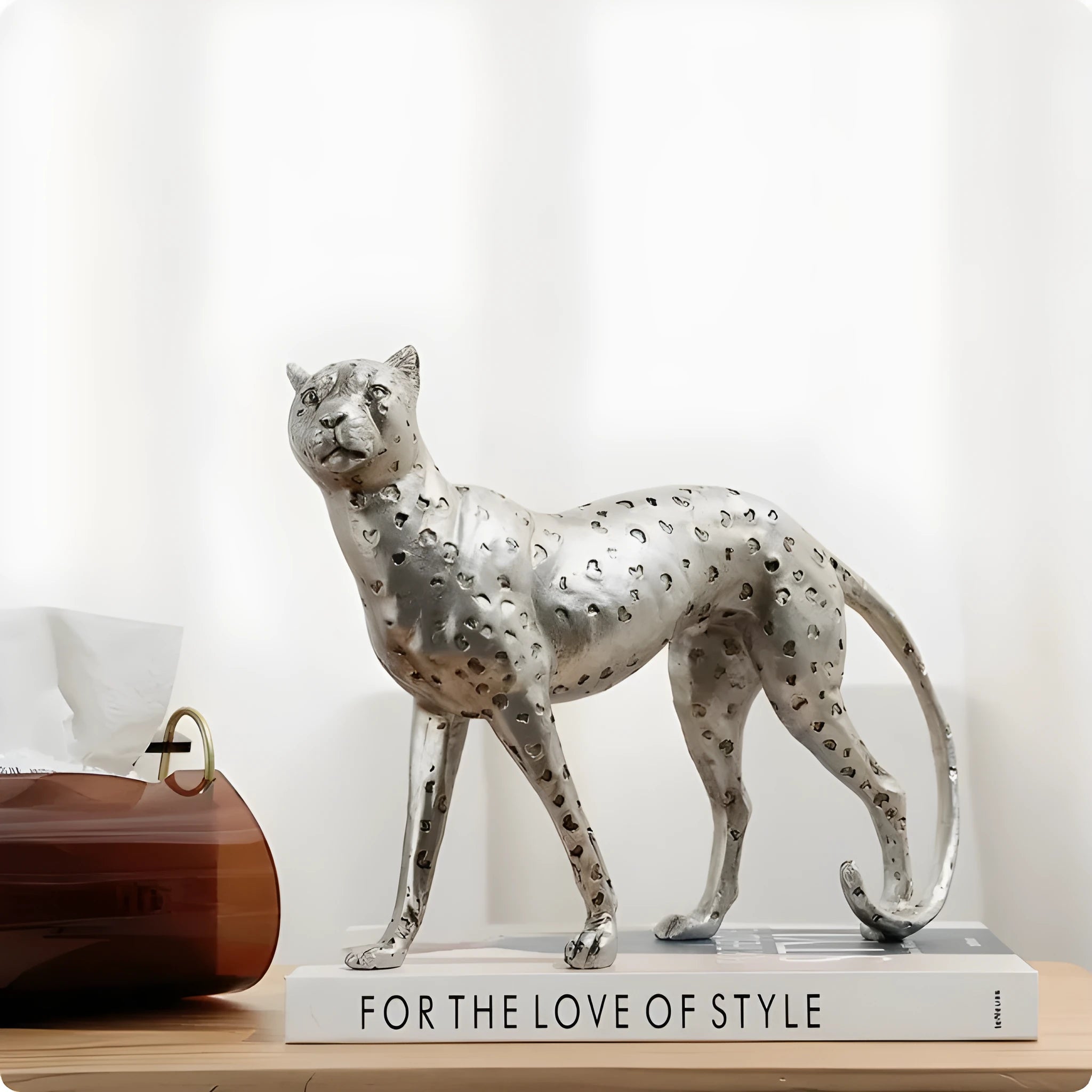 Resin leopard ornament in American Leopard colour on wooden shelf