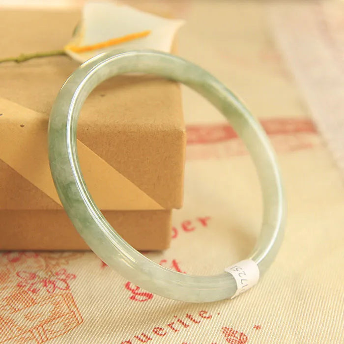Green jade waxy geometric bracelet with Chinese style design and adjustable sizing