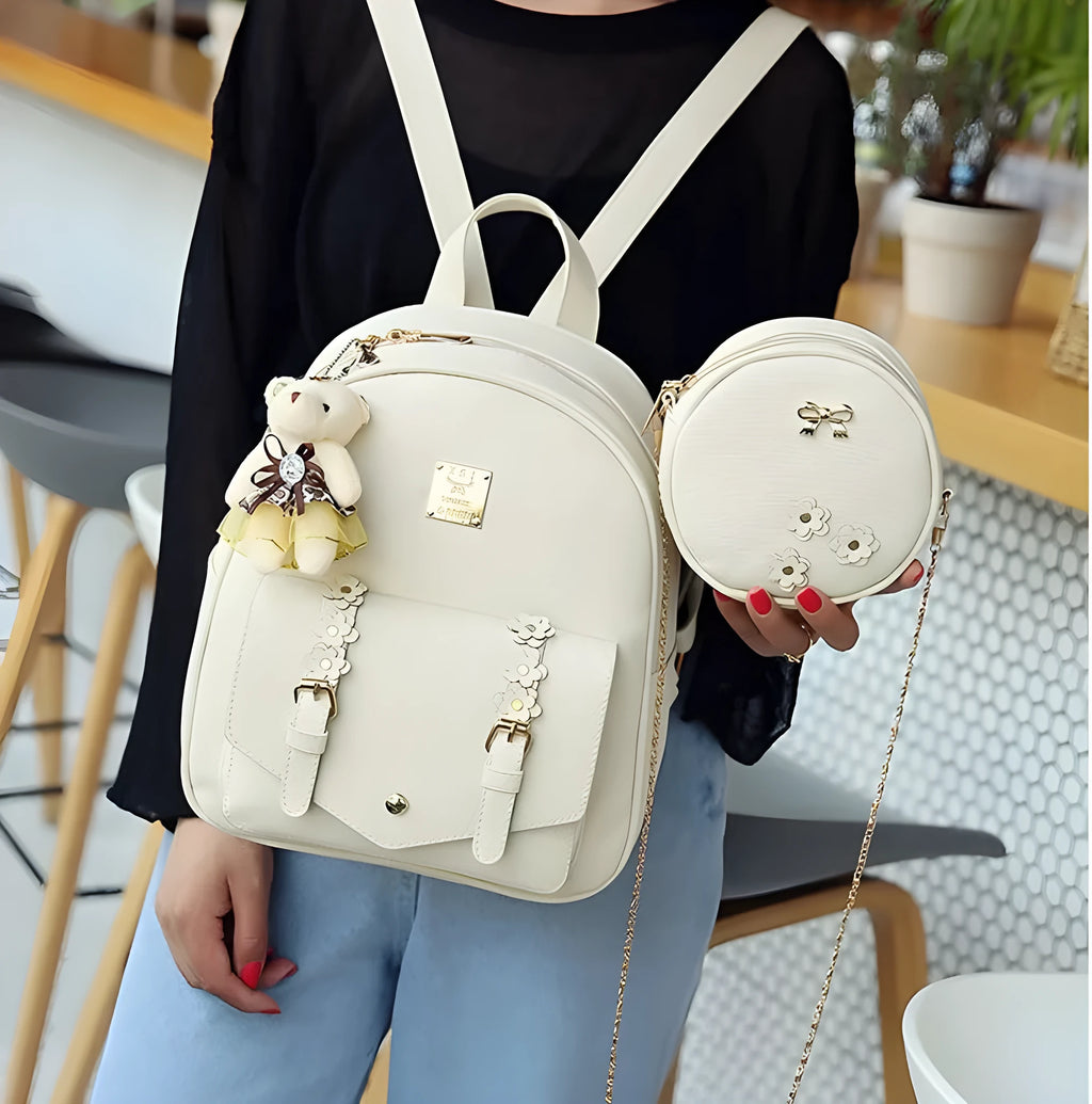 Women's three-piece backpack set with floral design including backpack, shoulder bag, and card holder