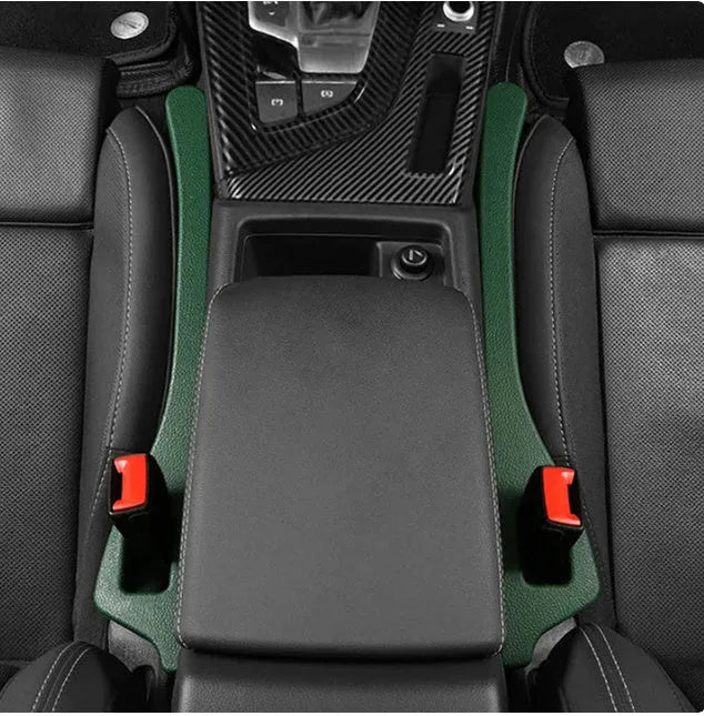 A flexible polyurethane car seat gap filler strip in black, placed between a car seat and centre console.
