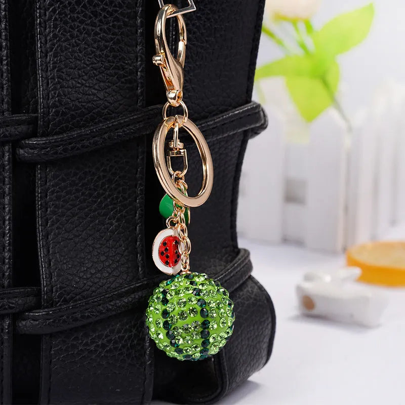 Green watermelon-shaped zinc alloy keychain measuring 12cm with keyring.