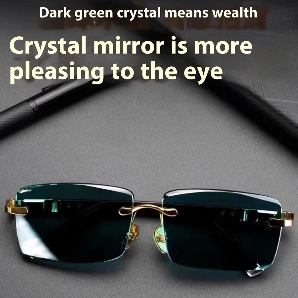 Dark green frameless crystal sunglasses with a glasses case and cleaning cloth.
