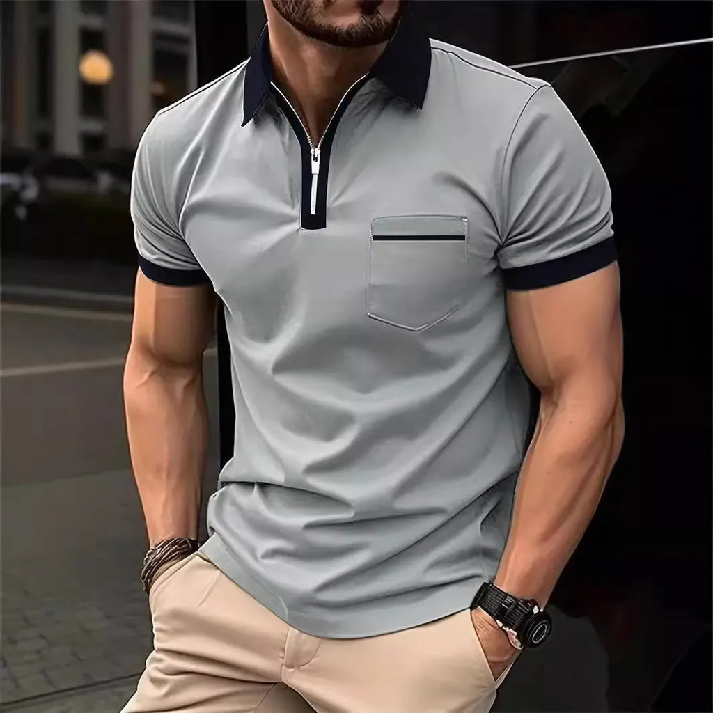 Man wearing a loose-fit casual short sleeve shirt with a chest pocket and zipper decoration.