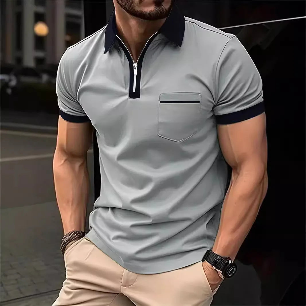 Man wearing a loose-fit casual short sleeve shirt with a chest pocket and zipper decoration.