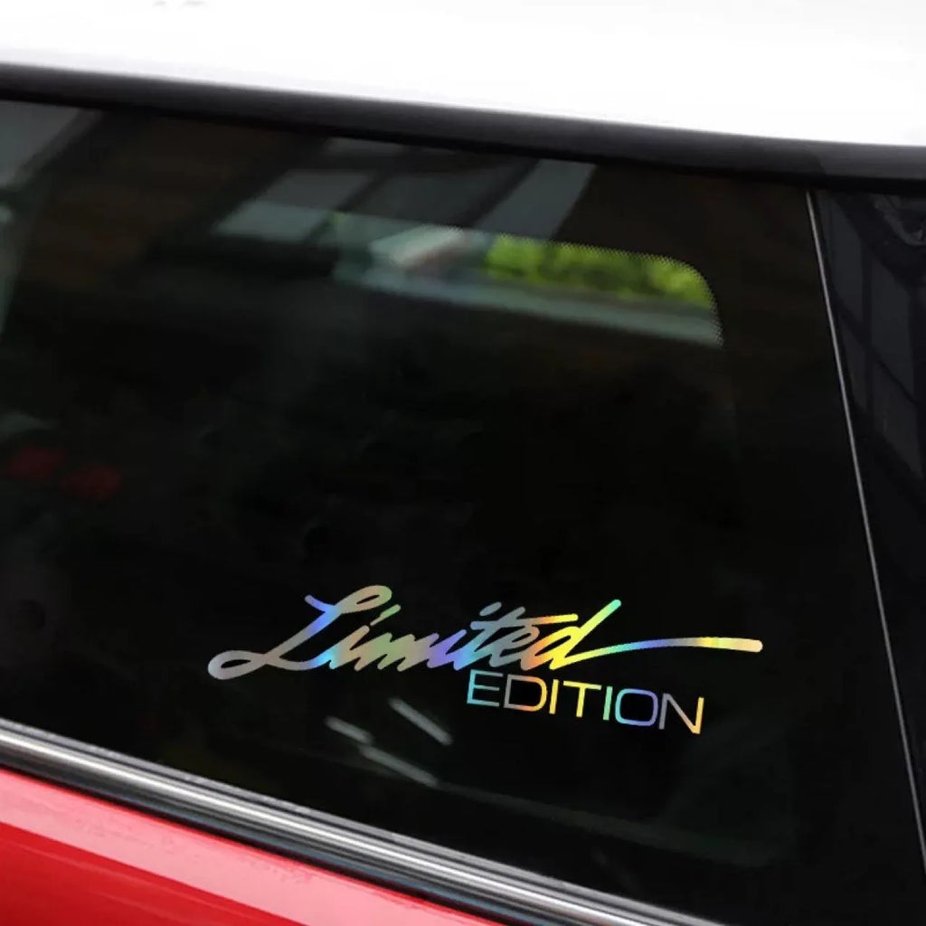 Black laser reflective text car sticker on a vehicle window.