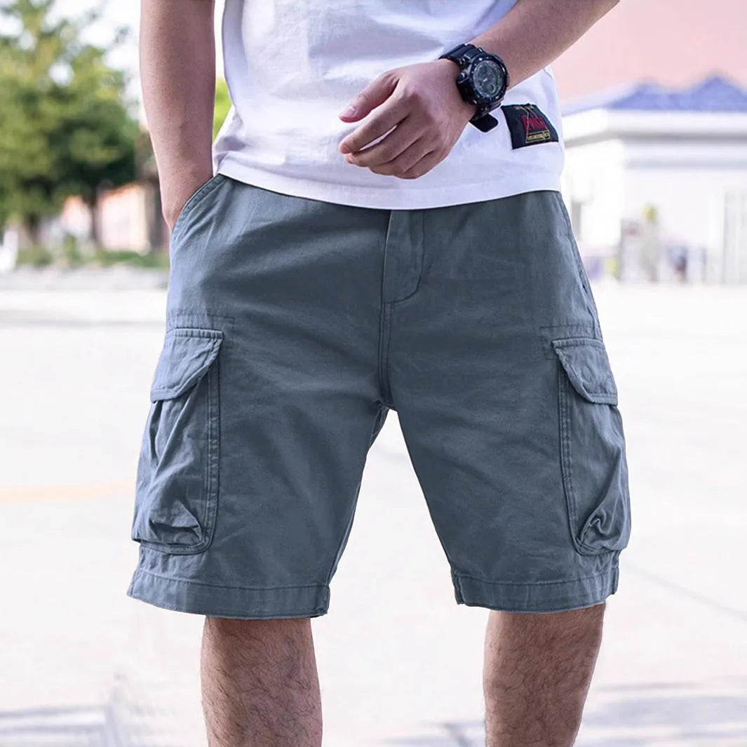 Men's loose-fitting cotton blend shorts in army green with a retro workwear style.