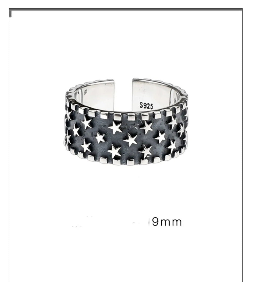 Pure silver multi five-pointed star ring with adjustable opening on a finger