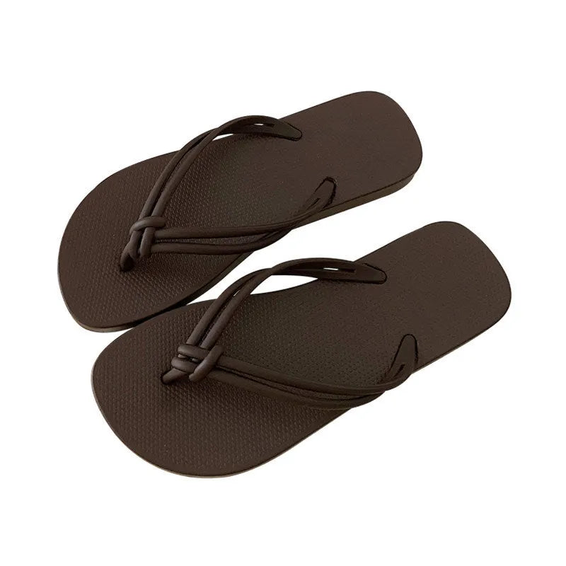 Men's PVC toe covering flip flops in beige on a plain background, showing non-slip sole.