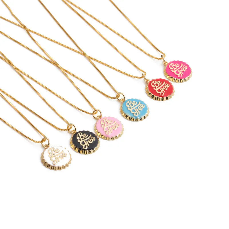 Copper bottle cap pendant necklace with gold plating on a box chain.
