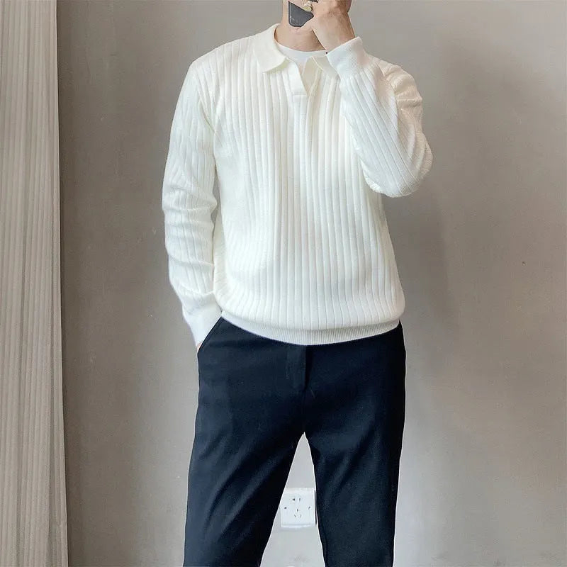 Man wearing a loose grey rabbit fur blend knitted pullover sweater, casual autumn style.