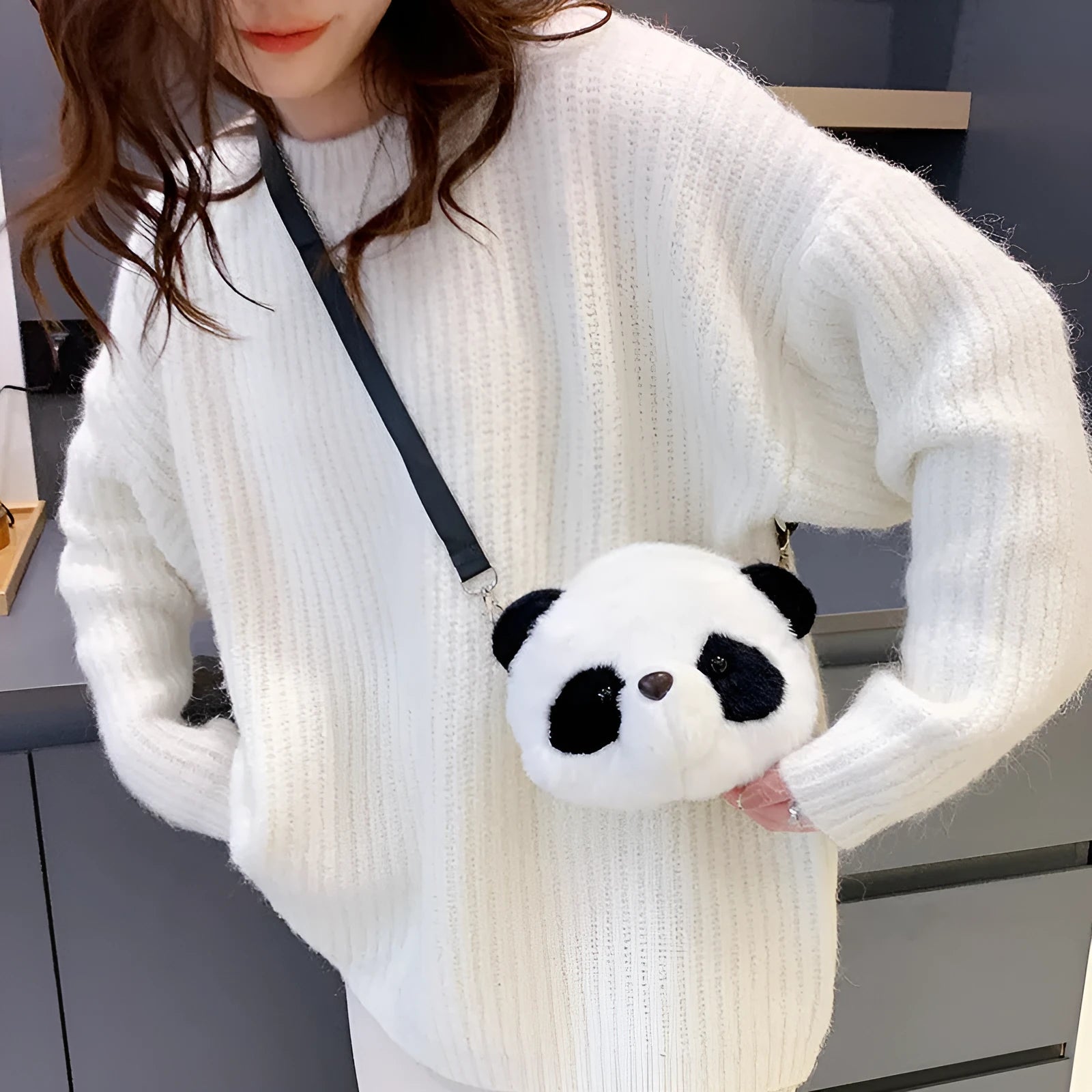 Soft plush cylindrical crossbody bag with panda head design, showing sandwich pocket.