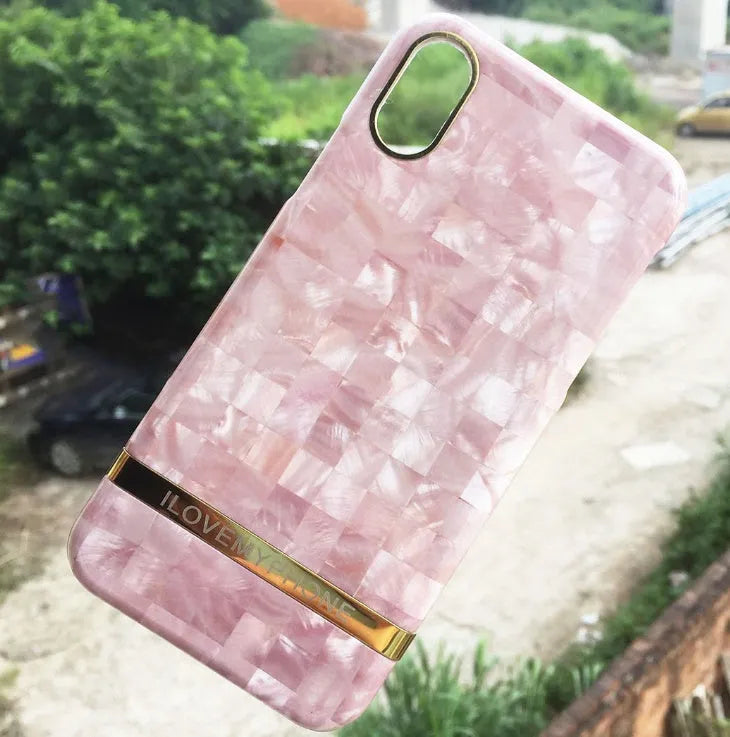 Marble pattern plastic case for iPhone on a table, shown in multiple colour options.