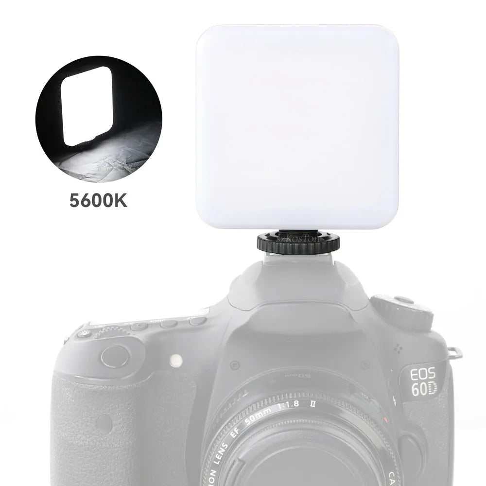 LED mini square universal camera flash on a pocket tripod, showing compact size and rotatable flash head.