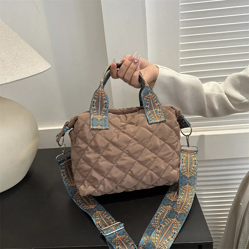 Soft horizontal square Oxford cloth shoulder messenger bag in green with embroidery detail and a single strap.