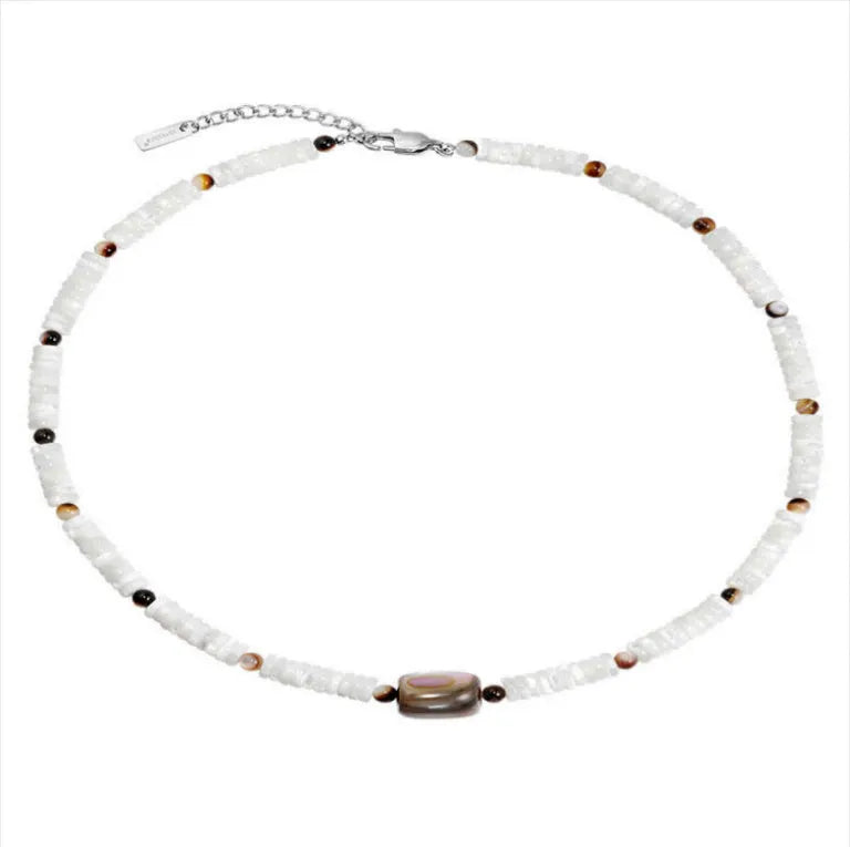 Men's vintage white shell necklace with round bead chain on neutral background