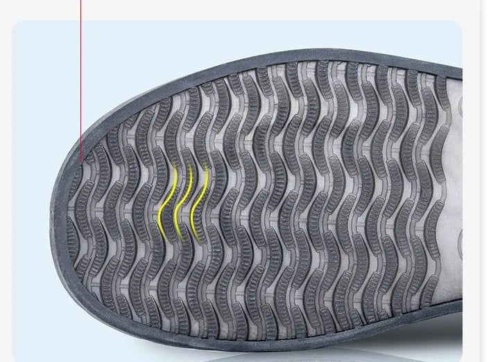 White high top PVC reusable waterproof shoe cover for women, shown on a foot.