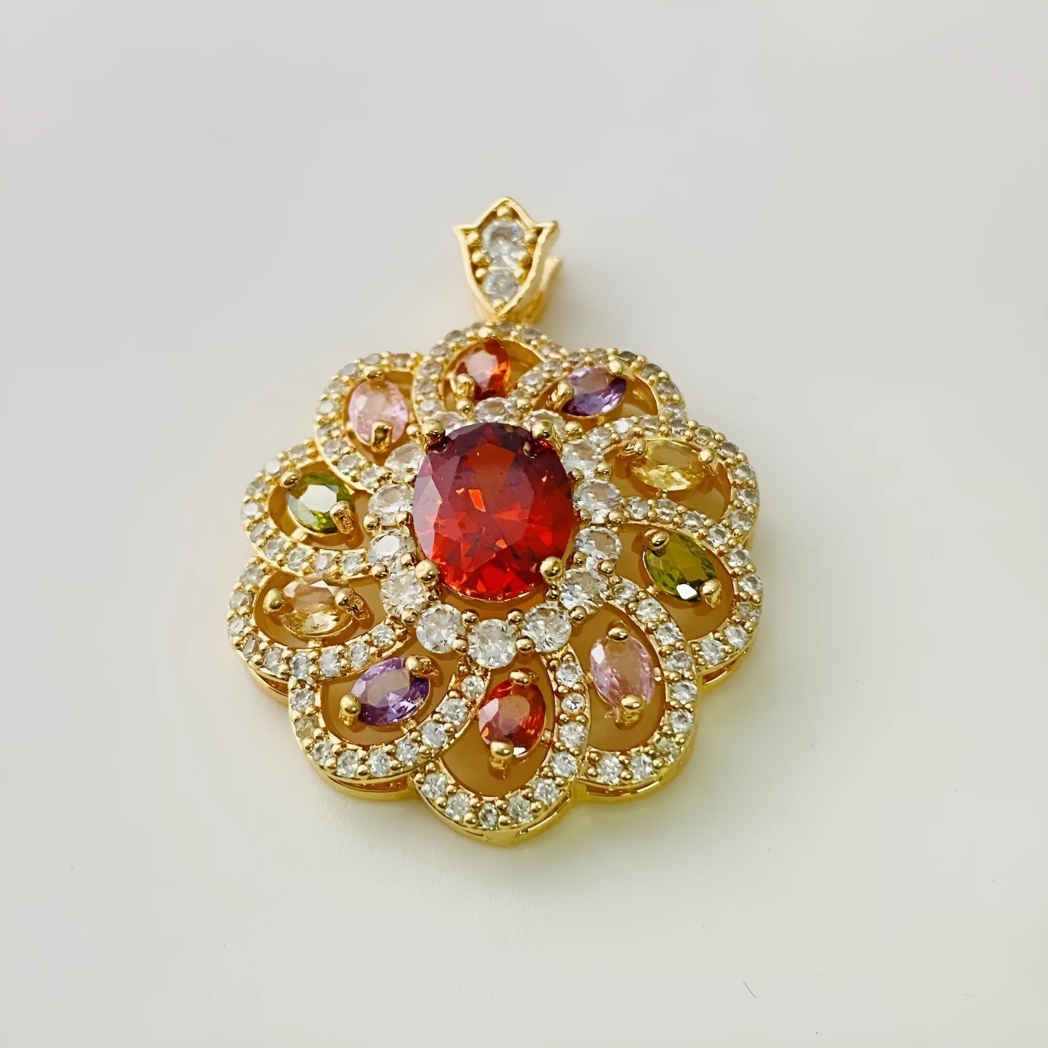 Close-up of a women's flower-shaped zircon pendant necklace in a gold electroplated finish on a model.