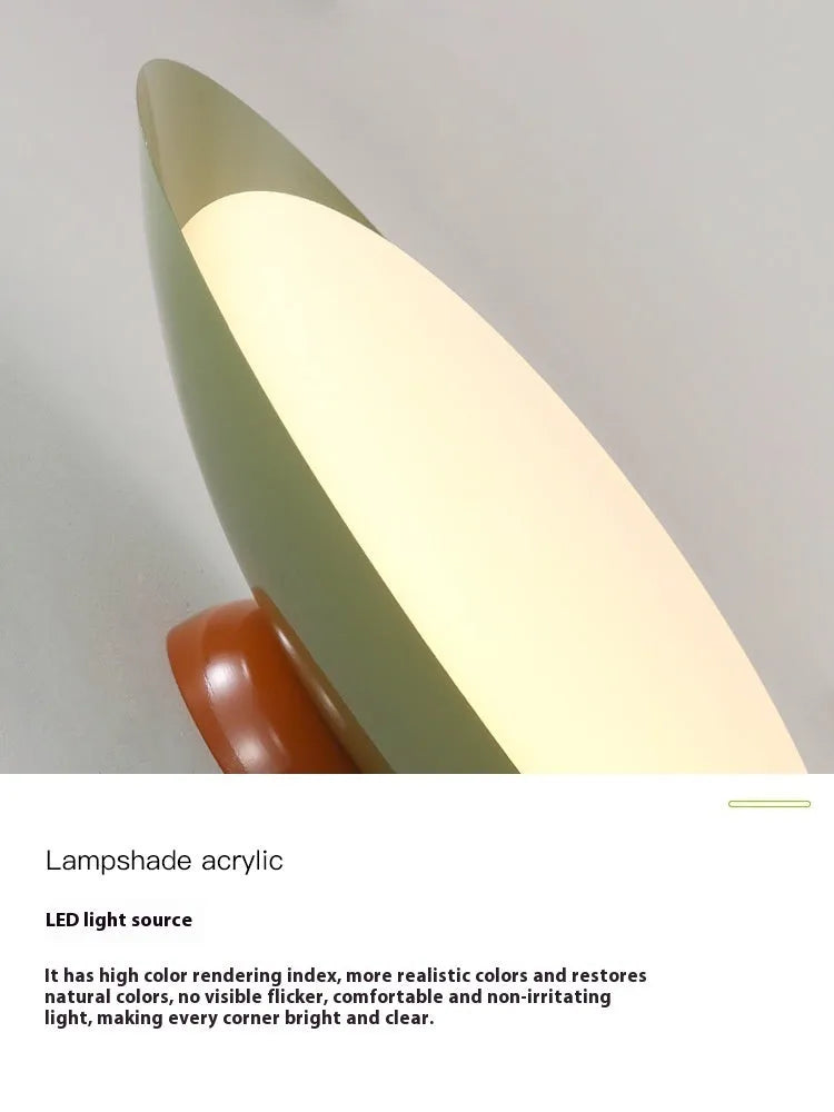 Modern cream-style flying saucer shaped ceiling lamp in a bedroom setting.