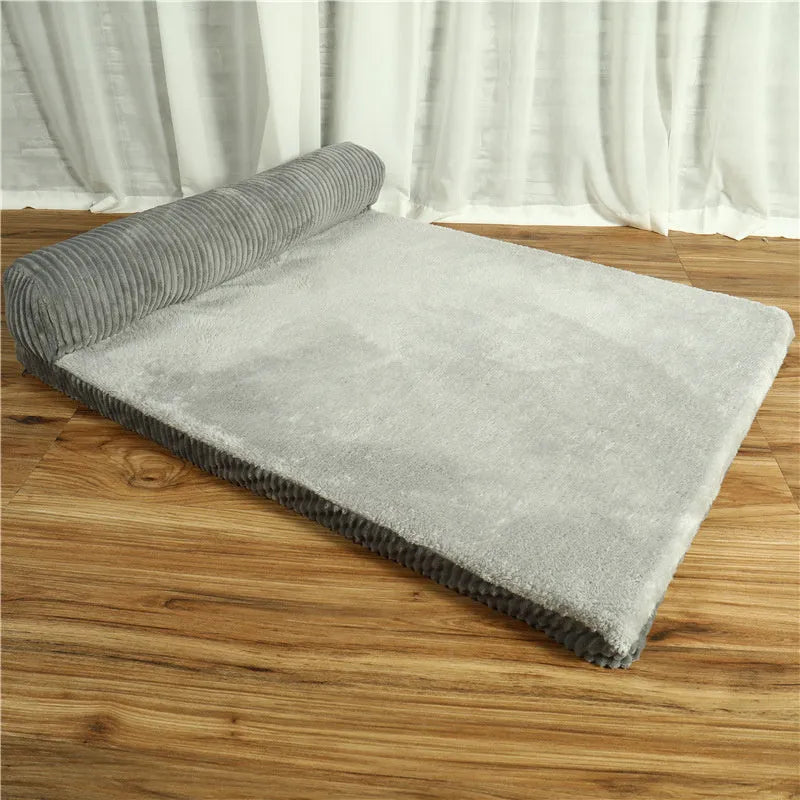 Corduroy pet dog bed sofa in a neutral colour with a raised edge and non-slip base.