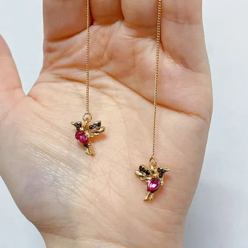 Bird hanging earrings with zirconium wings in long drop style