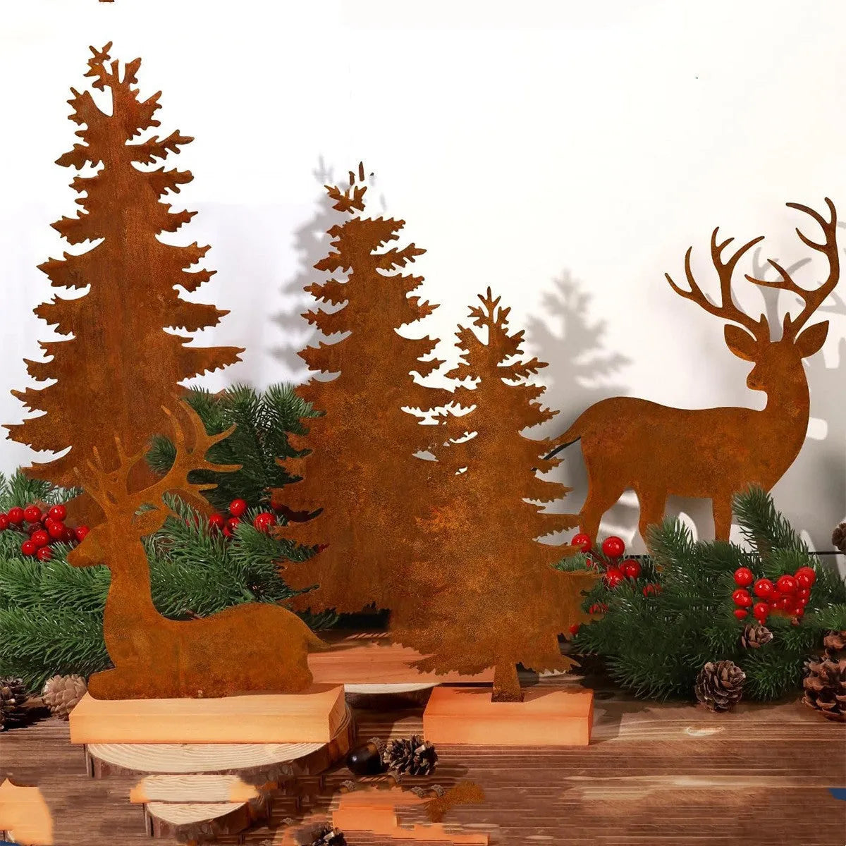 Three metal Christmas tree elk decorations with rusty patina finish displayed together