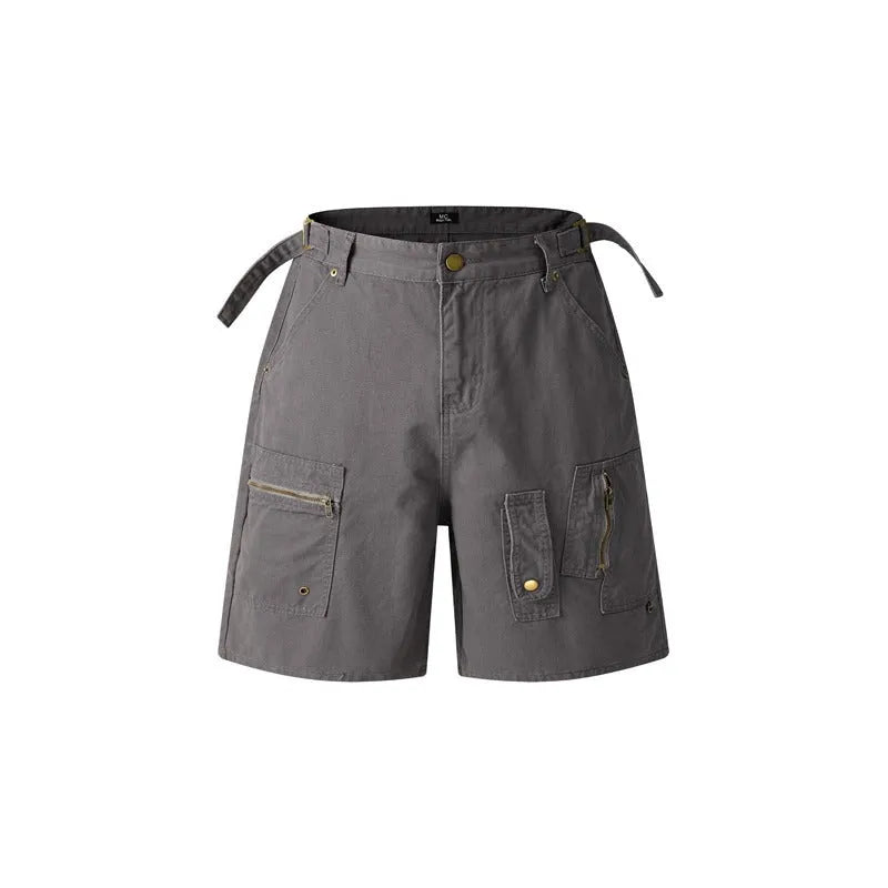 Man wearing grey retro loose-fit washed cotton workwear shorts with a half elastic waistband.