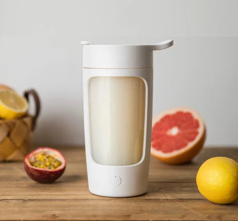 Portable automatic mixing cup in white with 650ml measurement markings visible