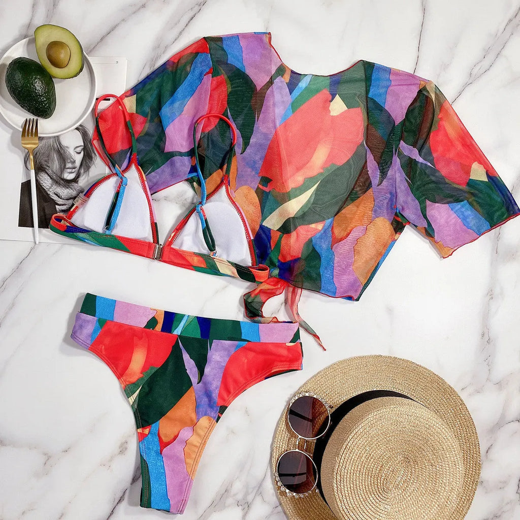 Red printed split swimsuit bikini for women on a mannequin