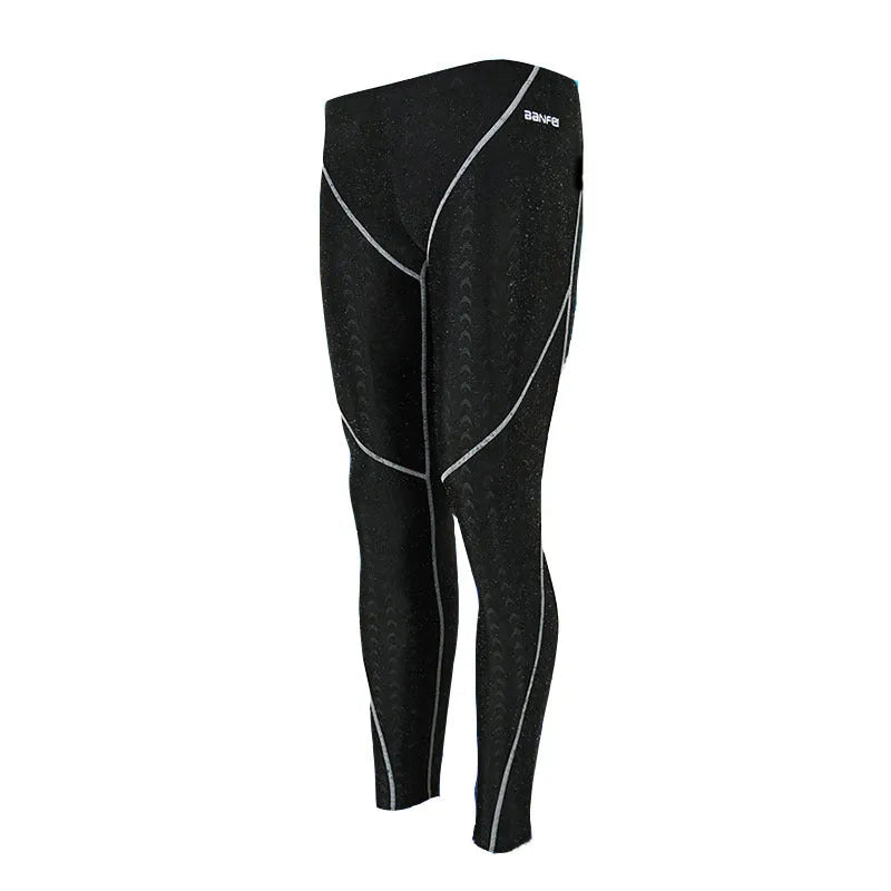 Men's nylon cropped swimming trunks in black with contrast line pattern for athletic swimming and fitness
