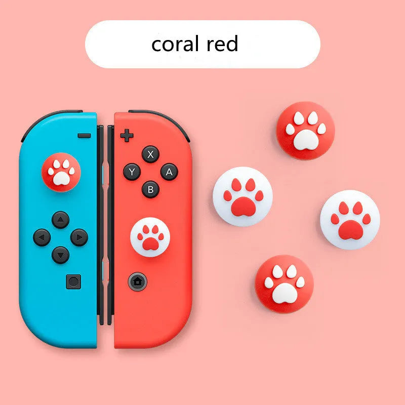 Four silicone rocker caps for Nintendo Switch Joy-Con controllers in assorted colours on a grey background.