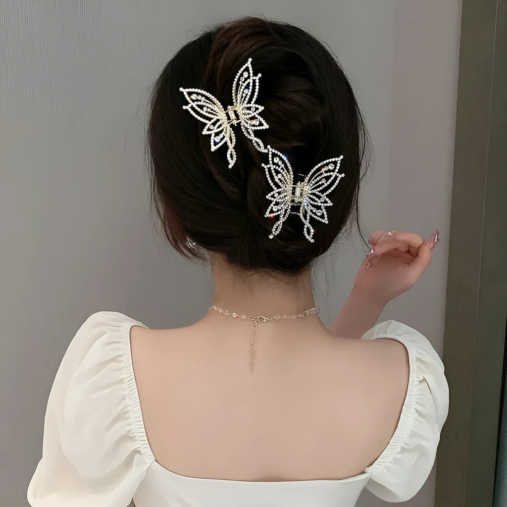 Butterfly-shaped hair clip with pearl or rhinestone decoration on alloy base