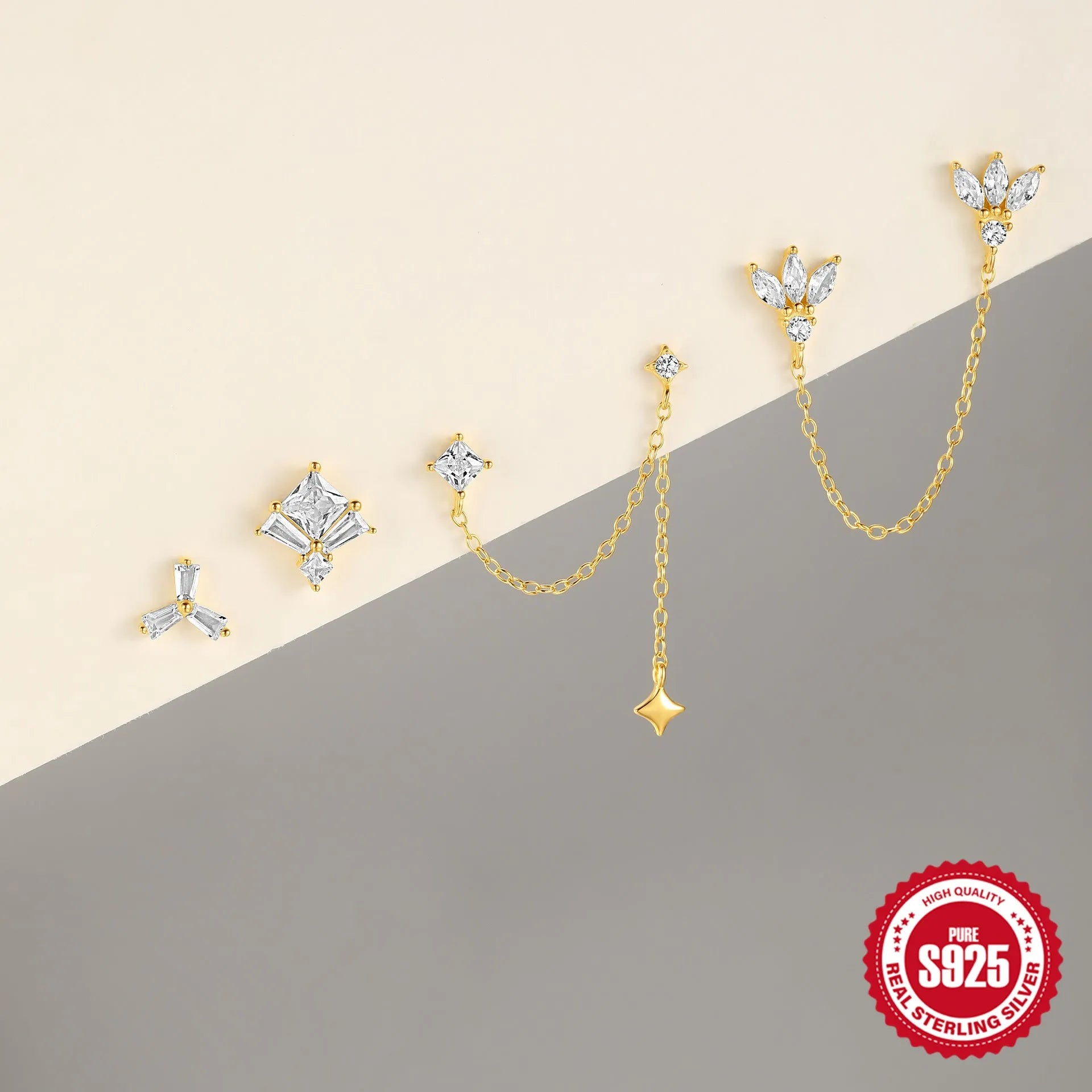 Close-up of a golden double ear piercings chain design stud earring made from S925 sterling silver with inlaid zircon stone.