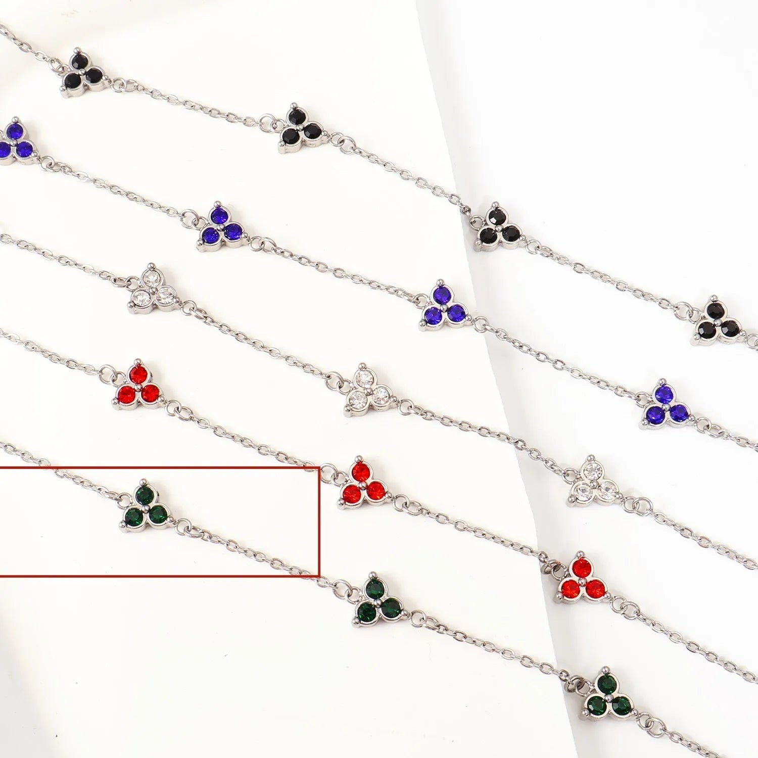 Geometric triangle women's bracelet in stainless steel with a choice of coloured centre stones on a gold or steel band.