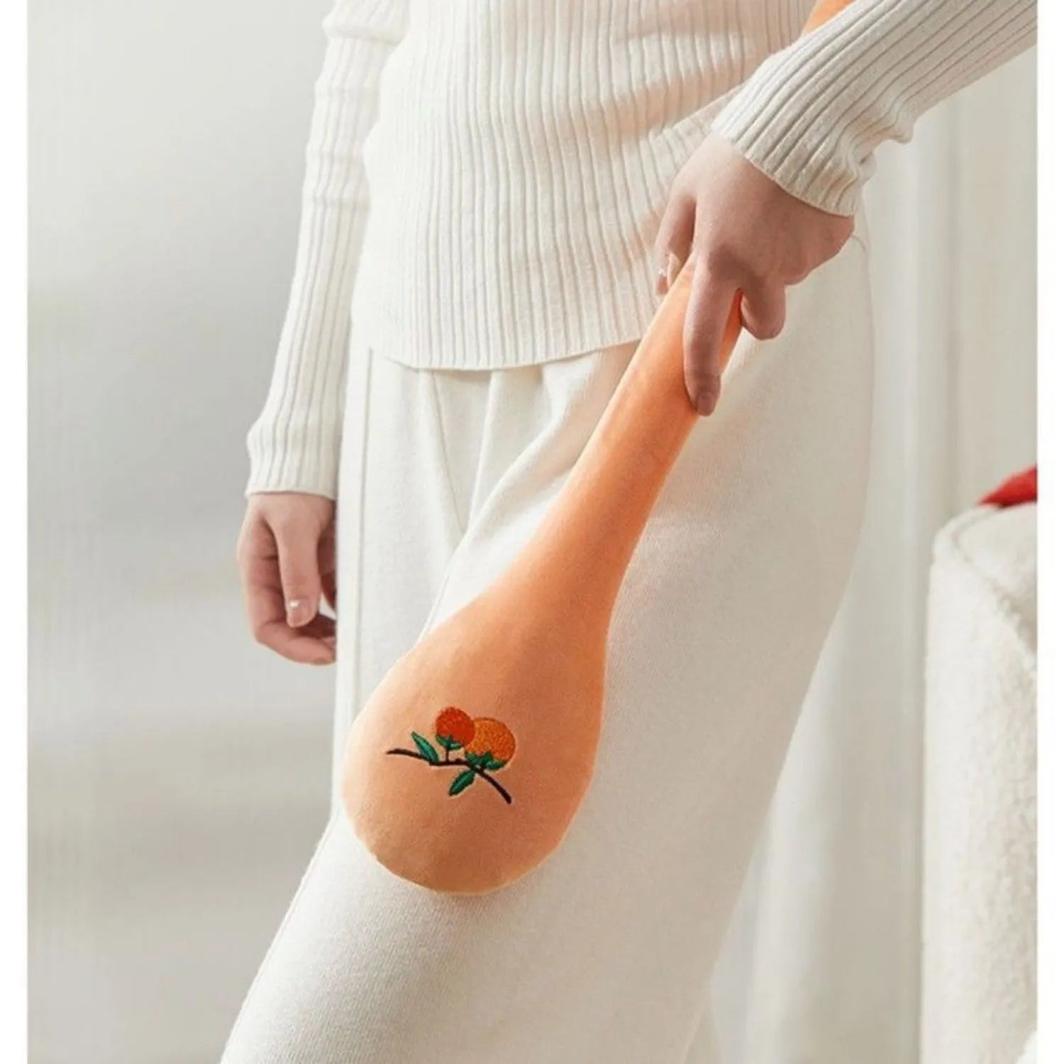 48 cm persimmon coloured back percussion massage stick with zipper detail