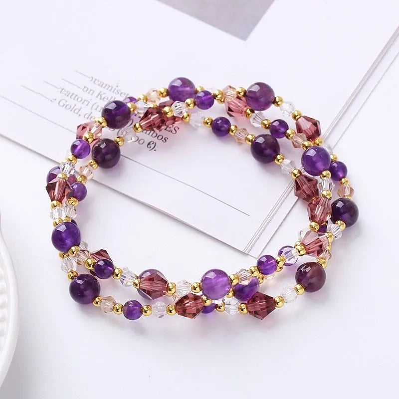 Women's handcrafted three-ring crystal bracelet with tourmaline, strawberry quartz, and amethyst beads on adjustable cord