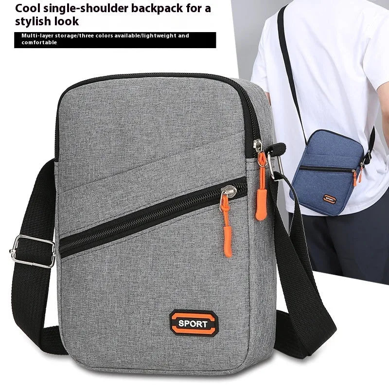 Ultra-light Oxford cloth crossbody commuter bag in silver grey with contrast colour detail.
