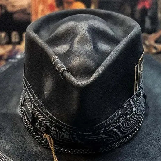 Handmade wool felt denim skull hat with a black conical crown on a white background.