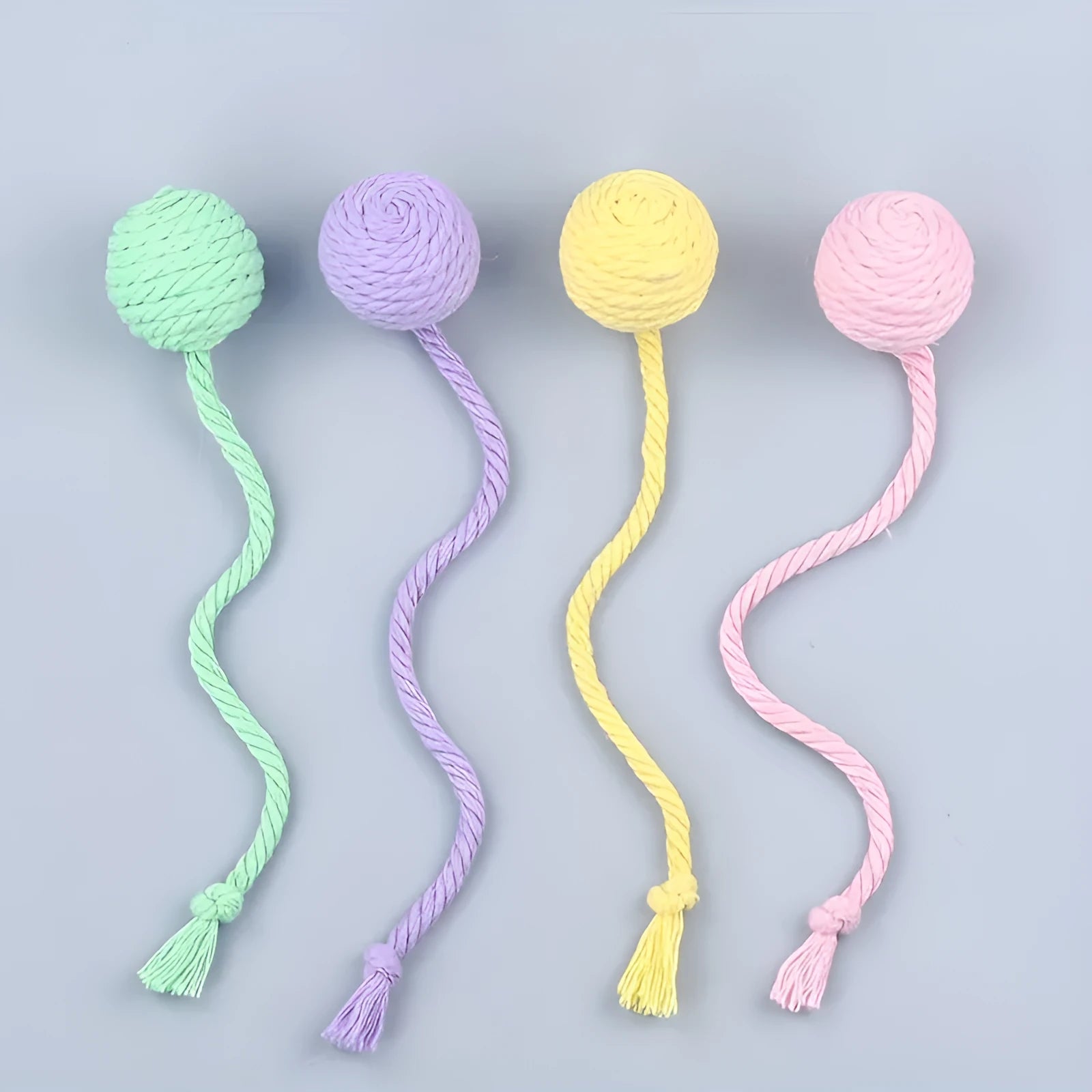 Colourful cat toy ball with rope handle and built-in bell for interactive play