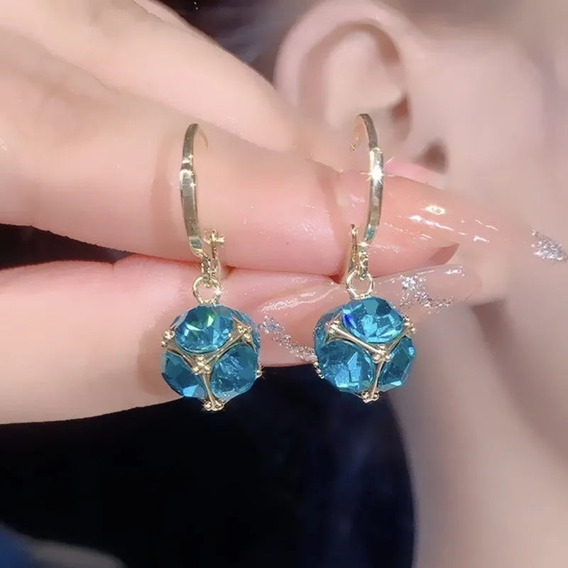 Geometric copper earrings with zircon stones in electroplated finish