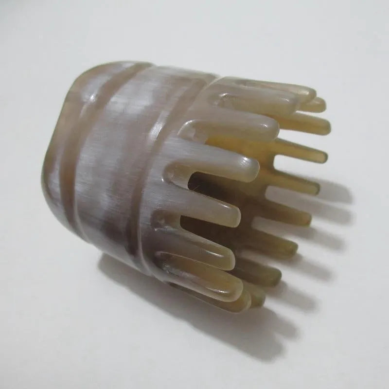 White buffalo horn comb with half-wide teeth and pointed tips for shampoo distribution and scalp massage