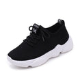 White women's thick-soled flying woven sports shoes with a front strap and rubber sole.