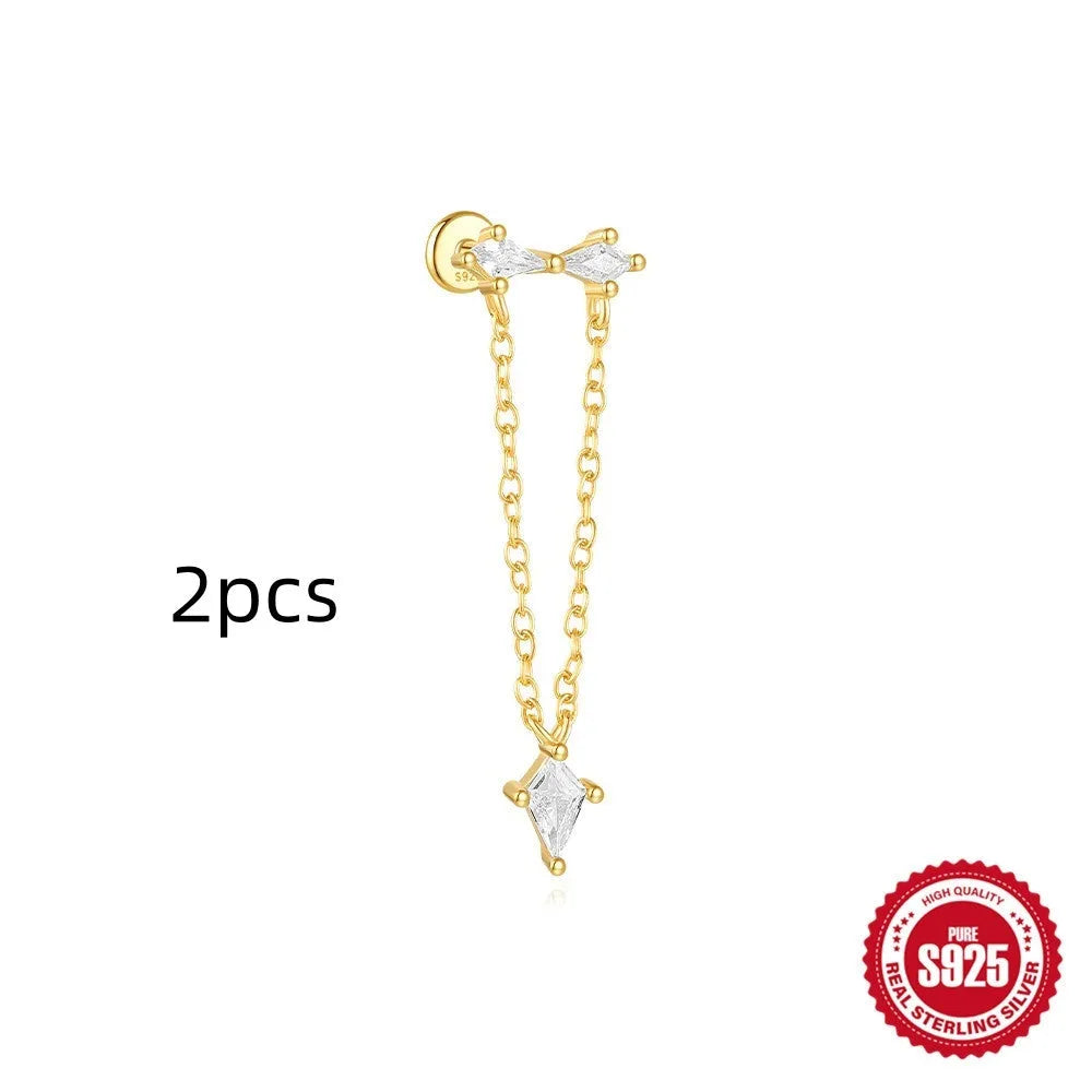 S925 sterling silver geometric kite shaped earrings with chain tassel and rhinestone detailing in gold tone finish