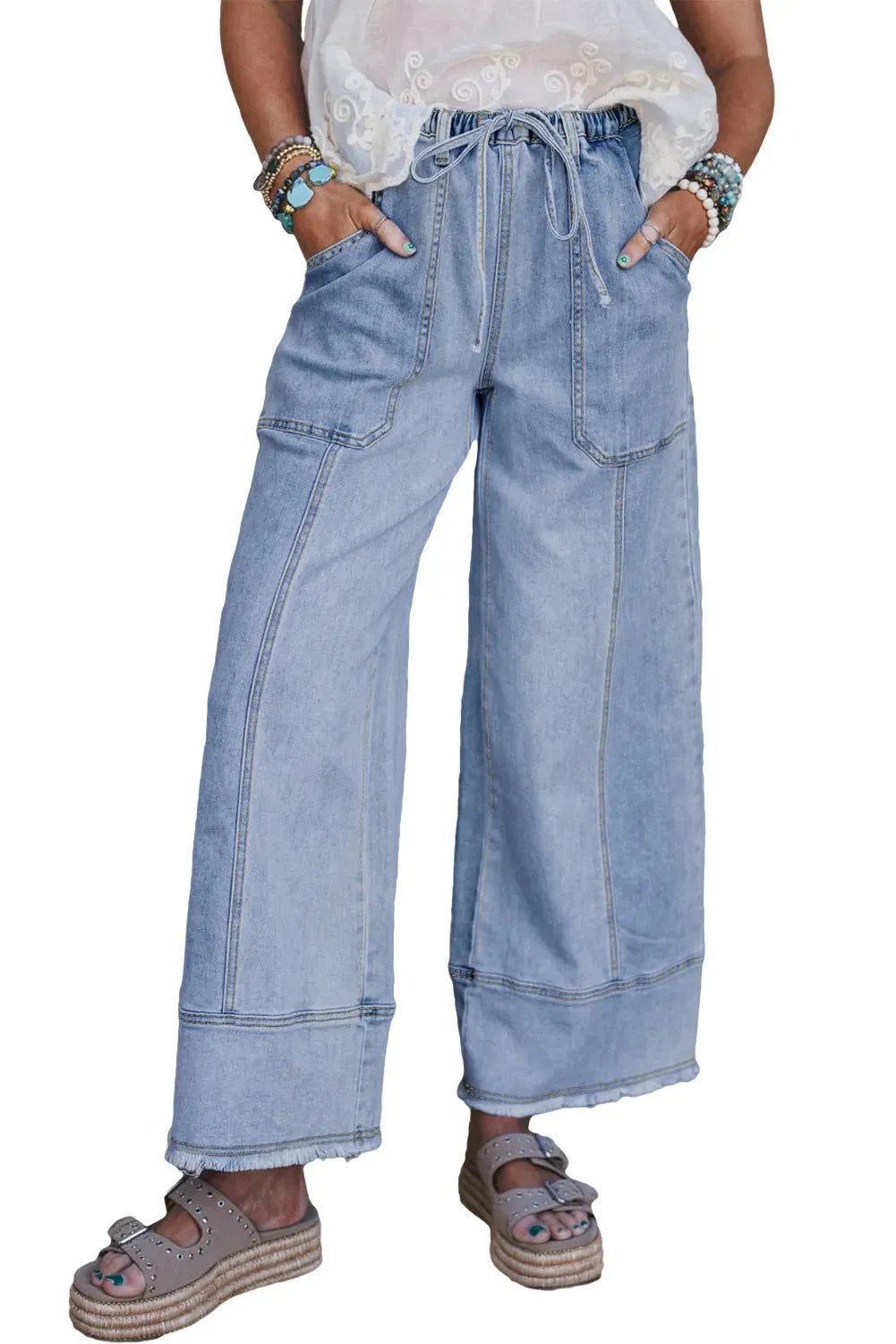 Beau blue women's wide leg denim trousers with drawstring waist and raw hem detail.