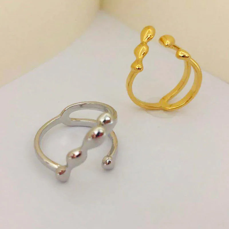 Brass fashion ring with spherical design in gold or silver colour for women's jewellery