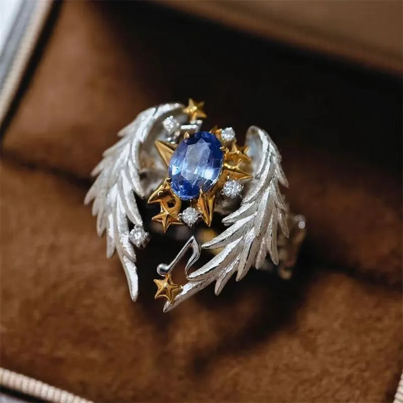 Adjustable geometric open-mouth ring with oiled alloy finish
