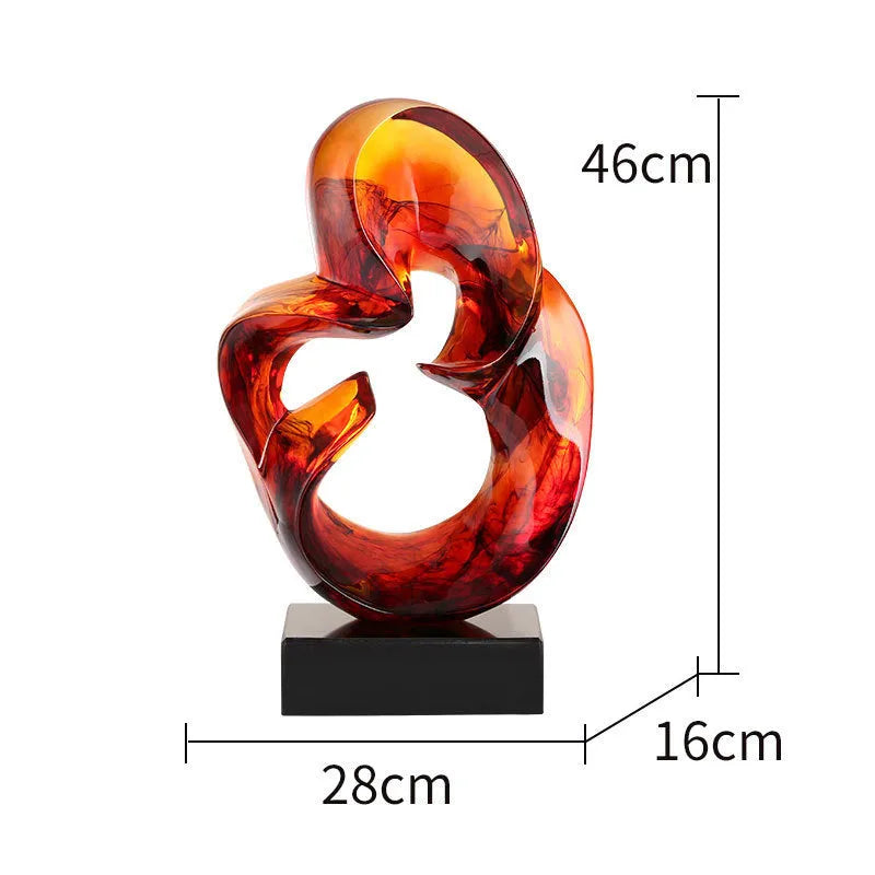 Modern transparent resin craft ornament in orange red and blue colour options on a plain background.