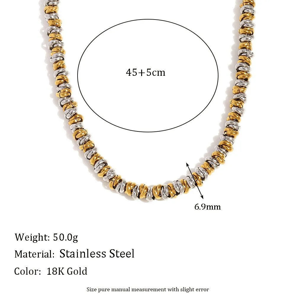 Gold electroplated women's jewellery set with geometric earrings, bracelet, and necklace on stainless steel