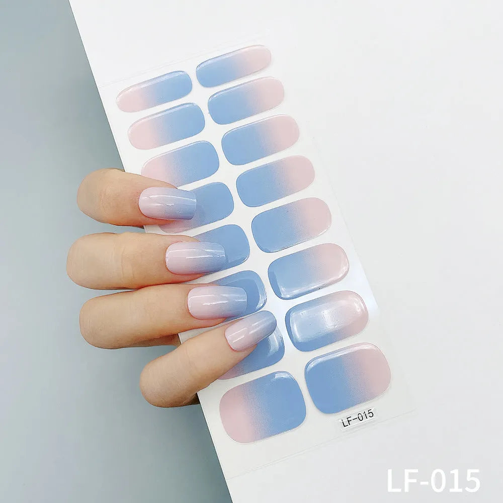 Set of 16 solid colour nail art stickers showing floral, geometric, and pattern designs for manicure application